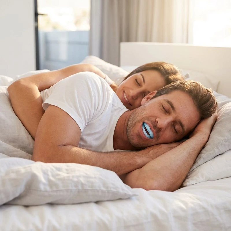Rested man smiling after a good night of sleep